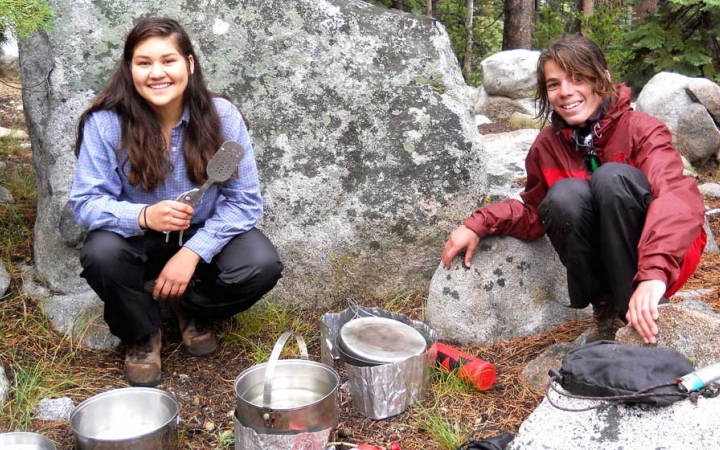 teens learn cooking skills on backpacking course